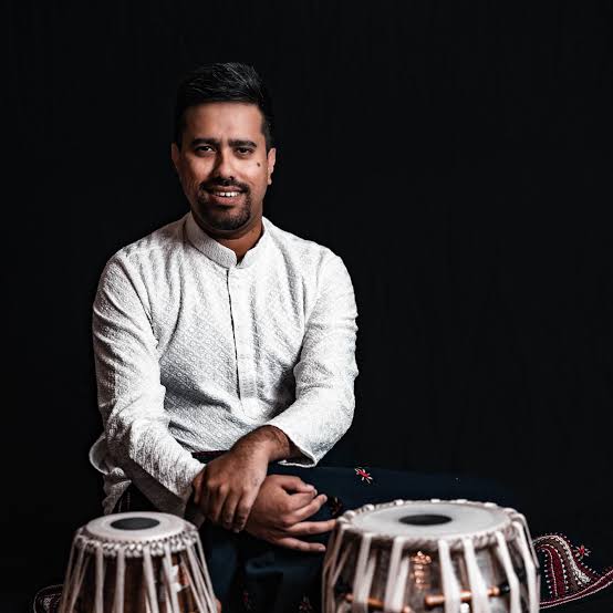 Aman Pal seated with a pair of tabla